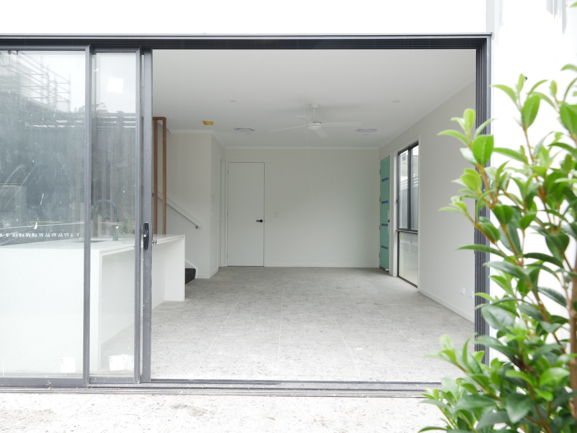 Before photo of empty open-plan living area